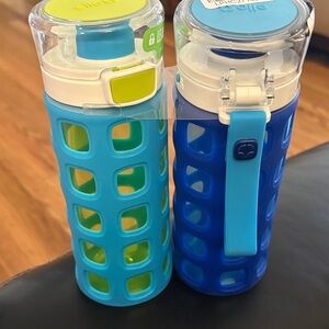Blue and Green Plastic Water Bottles